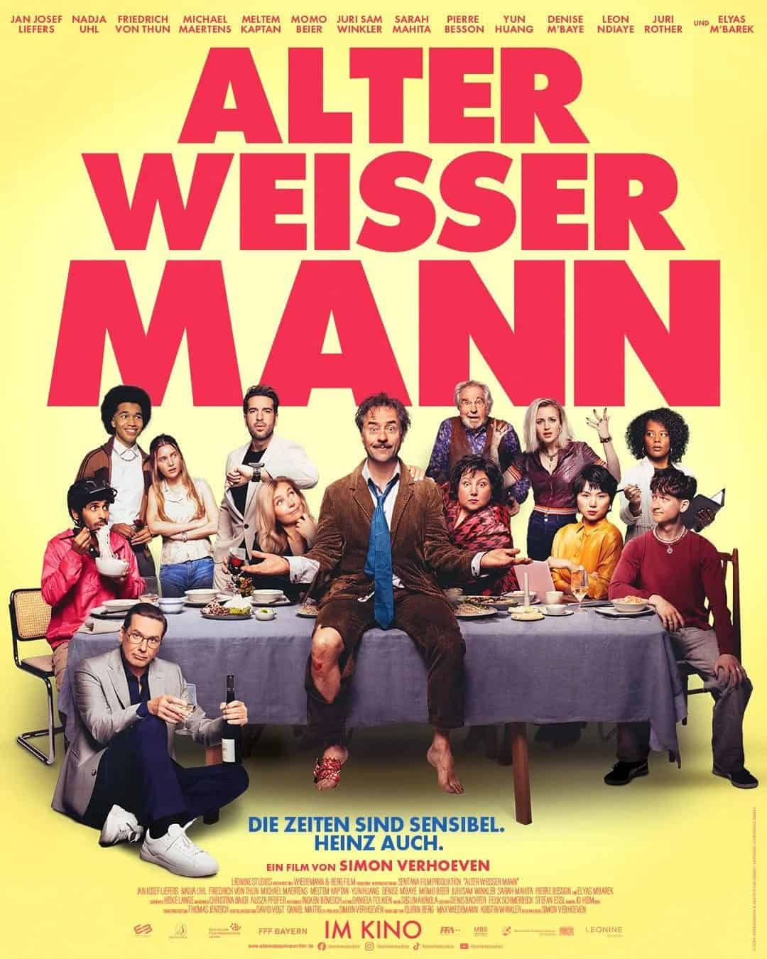 Filmplakat Alter Weisser Mann, verschiedene Charaktere am Tisch.